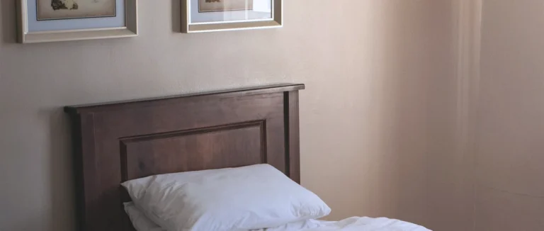 A quiet single bedroom at a residential alcohol rehab centre in Cape Town, in warm afternoon light
