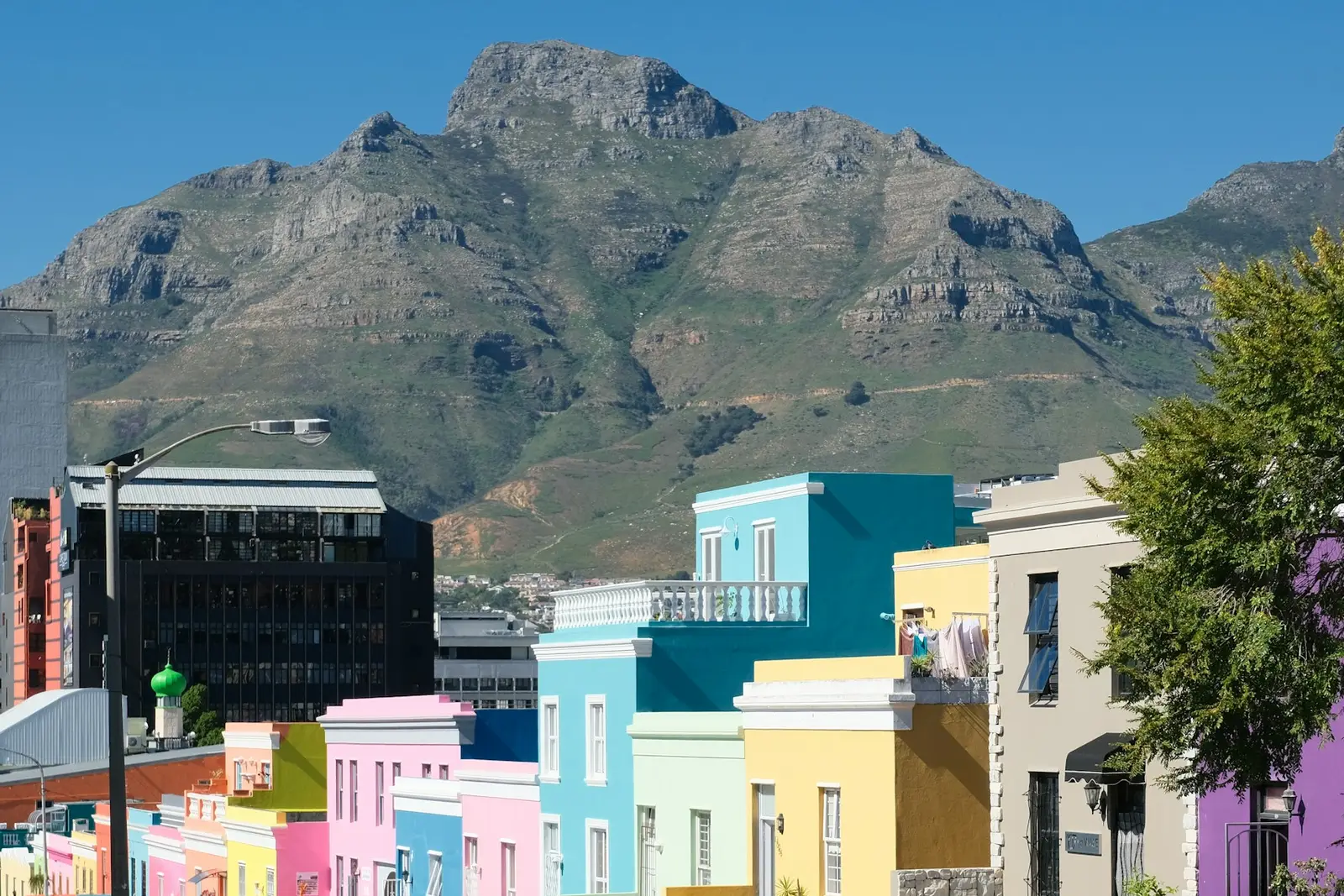Colourful houses in Bo-Kaap, Cape Town, below Table Mountain
