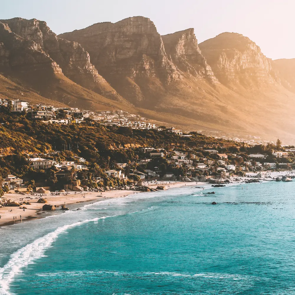 Clifton beach and the Twelve Apostles in warm evening light, Cape Town