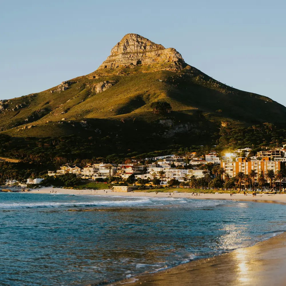 Golden morning light over Lion's Head mountain and Clifton beach
