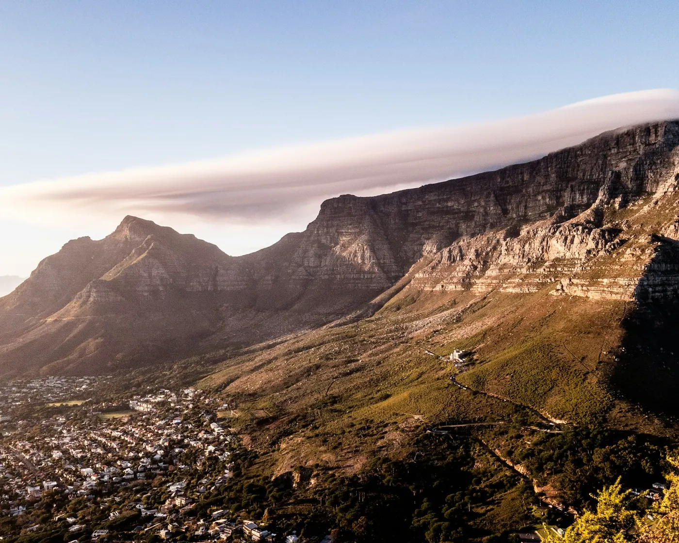 Table Mountain with a long lenticular cloud draped over its summit above Cape Town