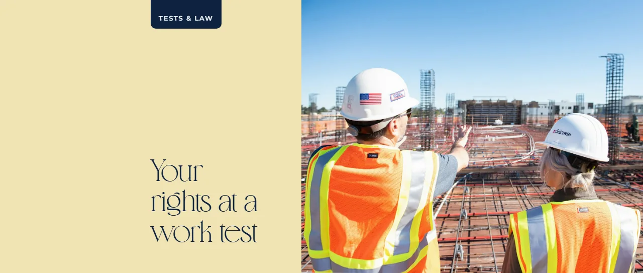 Two construction workers in safety vests at site